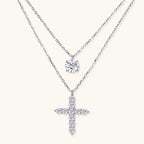 Anointed Garments layered necklace set featuring a round moissanite pendant and a cross pendant in platinum-plated silver