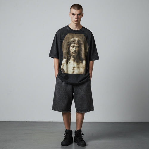 Anointed Garments unisex mineral wash cotton t-shirt with a Jesus graphic print and raglan sleeves on a male model.