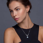 Anointed Garments Celestial Arc Moissanite Necklace featuring a blue stone pendant on a platinum-plated silver chain.