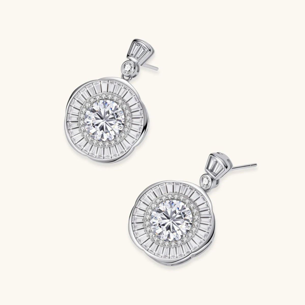 Anointed Garments celestial sunburst drop earrings in platinum-plated sterling silver with round-cut moissanite stones.