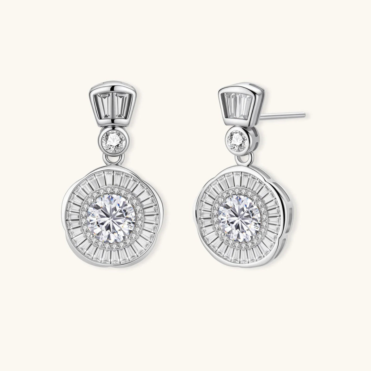 Anointed Garments celestial sunburst drop earrings in platinum-plated sterling silver with round-cut moissanite stones.