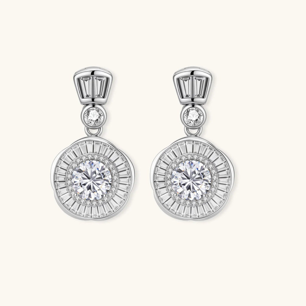 Anointed Garments celestial sunburst drop earrings in platinum-plated sterling silver with round-cut moissanite stones.