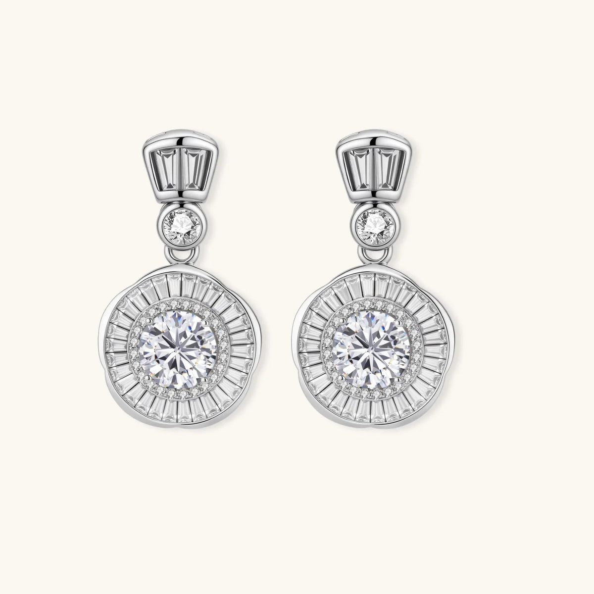 Anointed Garments celestial sunburst drop earrings in platinum-plated sterling silver with round-cut moissanite stones.