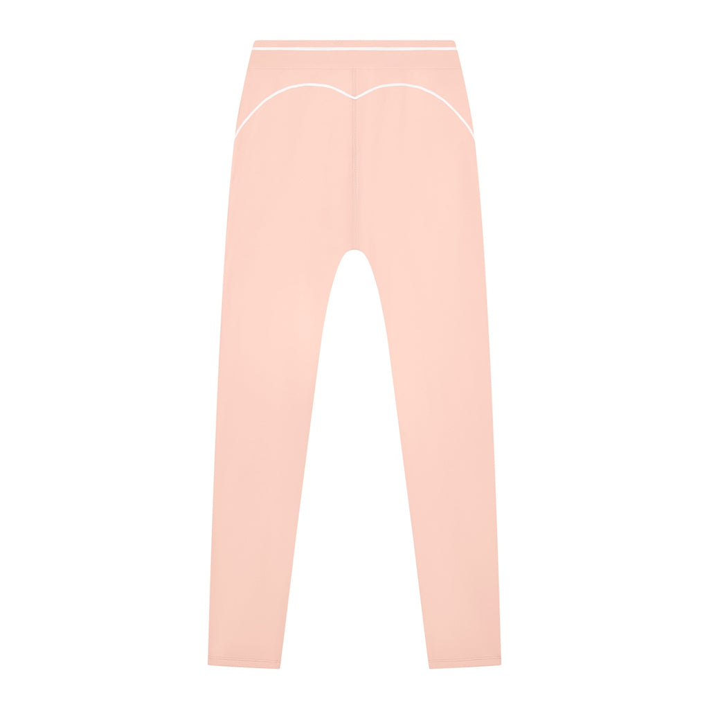 Anointed Garments high-waisted peach athletic leggings with white contrast piping for a supportive, flexible fit.
