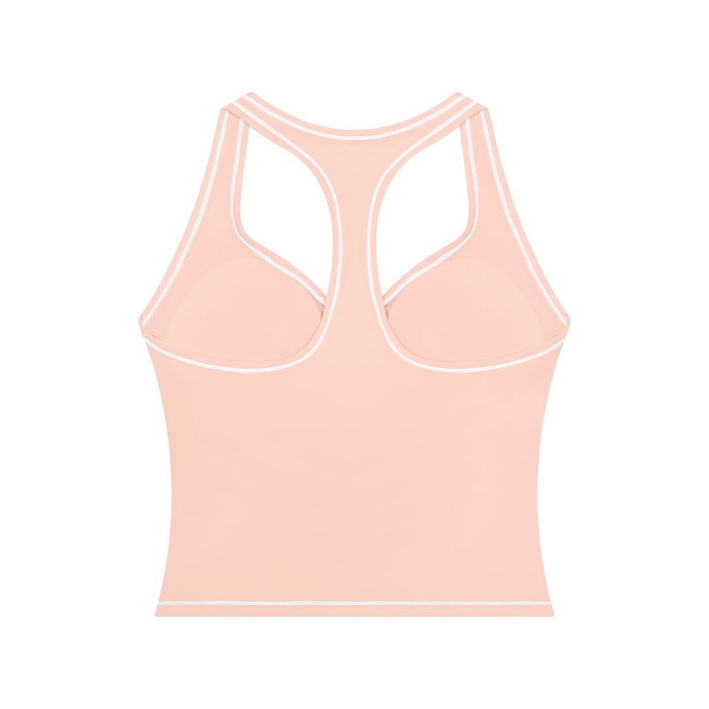 Anointed Garments peach racerback performance tank top with white contrast piping and built-in support for workouts.