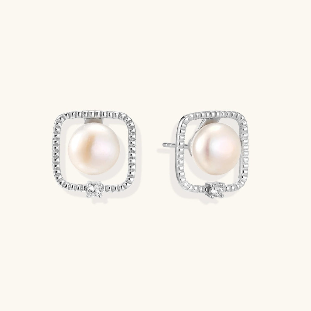 Anointed Garments Pearl Halo Studs featuring round freshwater pearls in architectural square rhodium-plated silver.