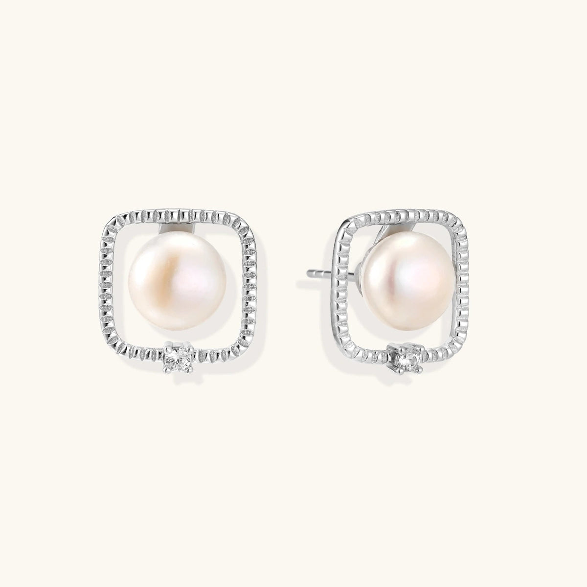 Anointed Garments Pearl Halo Studs featuring round freshwater pearls in architectural square rhodium-plated silver.