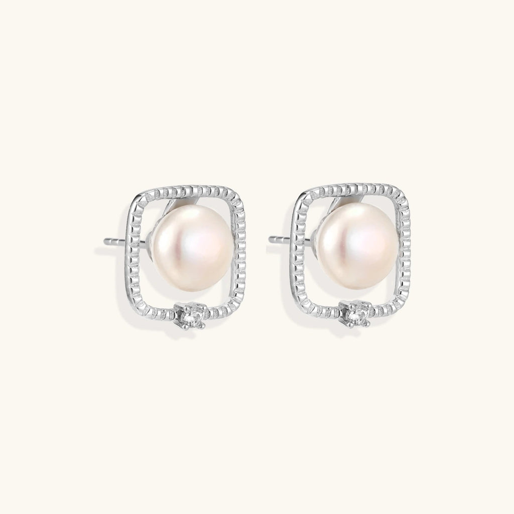 Anointed Garments Pearl Halo Studs featuring round freshwater pearls in square rhodium-plated sterling silver settings.