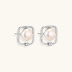 Anointed Garments Pearl Halo Studs featuring round freshwater pearls in square rhodium-plated sterling silver settings.