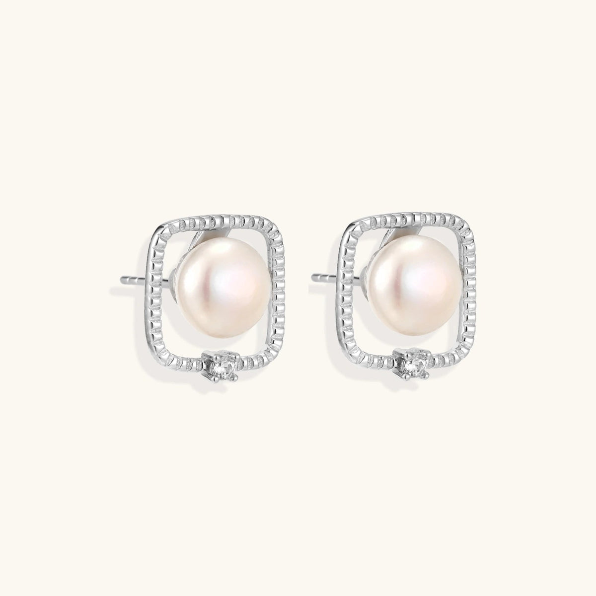 Anointed Garments Pearl Halo Studs featuring round freshwater pearls in square rhodium-plated sterling silver settings.