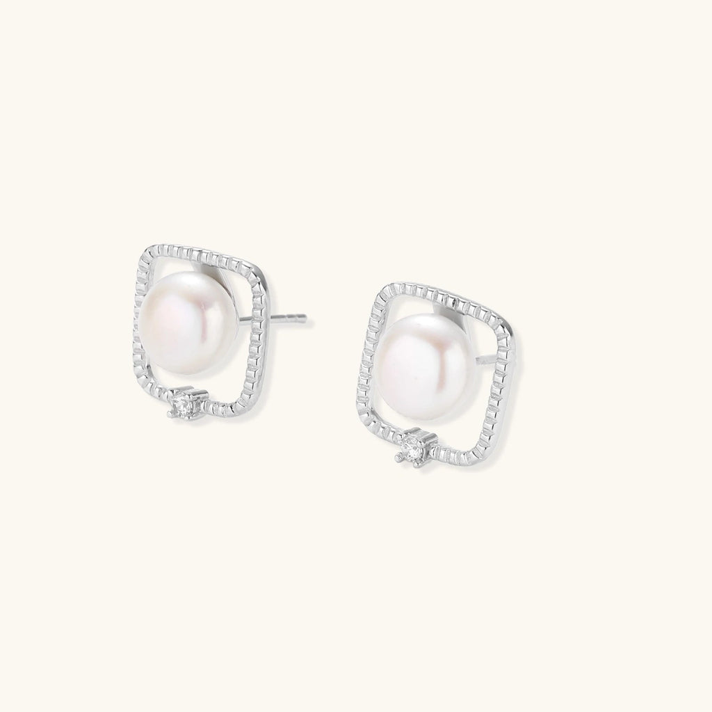 Anointed Garments Pearl Halo Studs featuring round freshwater pearls in square rhodium-plated sterling silver settings.