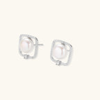 Anointed Garments Pearl Halo Studs featuring round freshwater pearls in square rhodium-plated sterling silver settings.