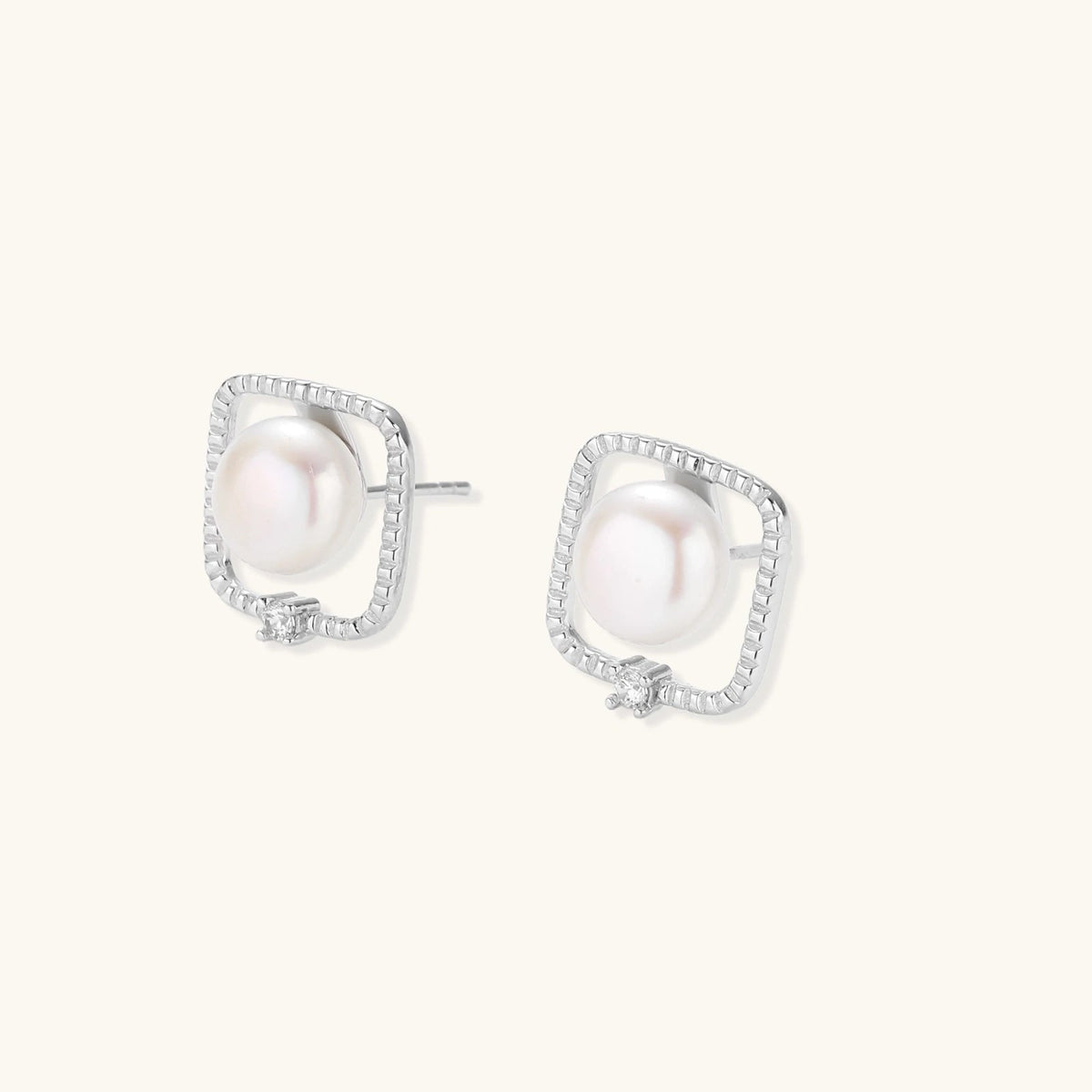 Anointed Garments Pearl Halo Studs featuring round freshwater pearls in square rhodium-plated sterling silver settings.