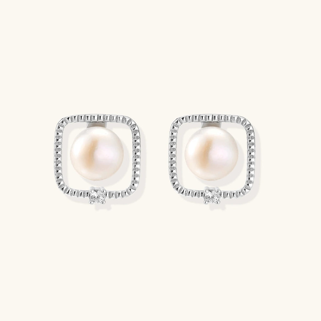 Anointed Garments Pearl Halo Studs featuring round freshwater pearls in square rhodium-plated sterling silver settings.