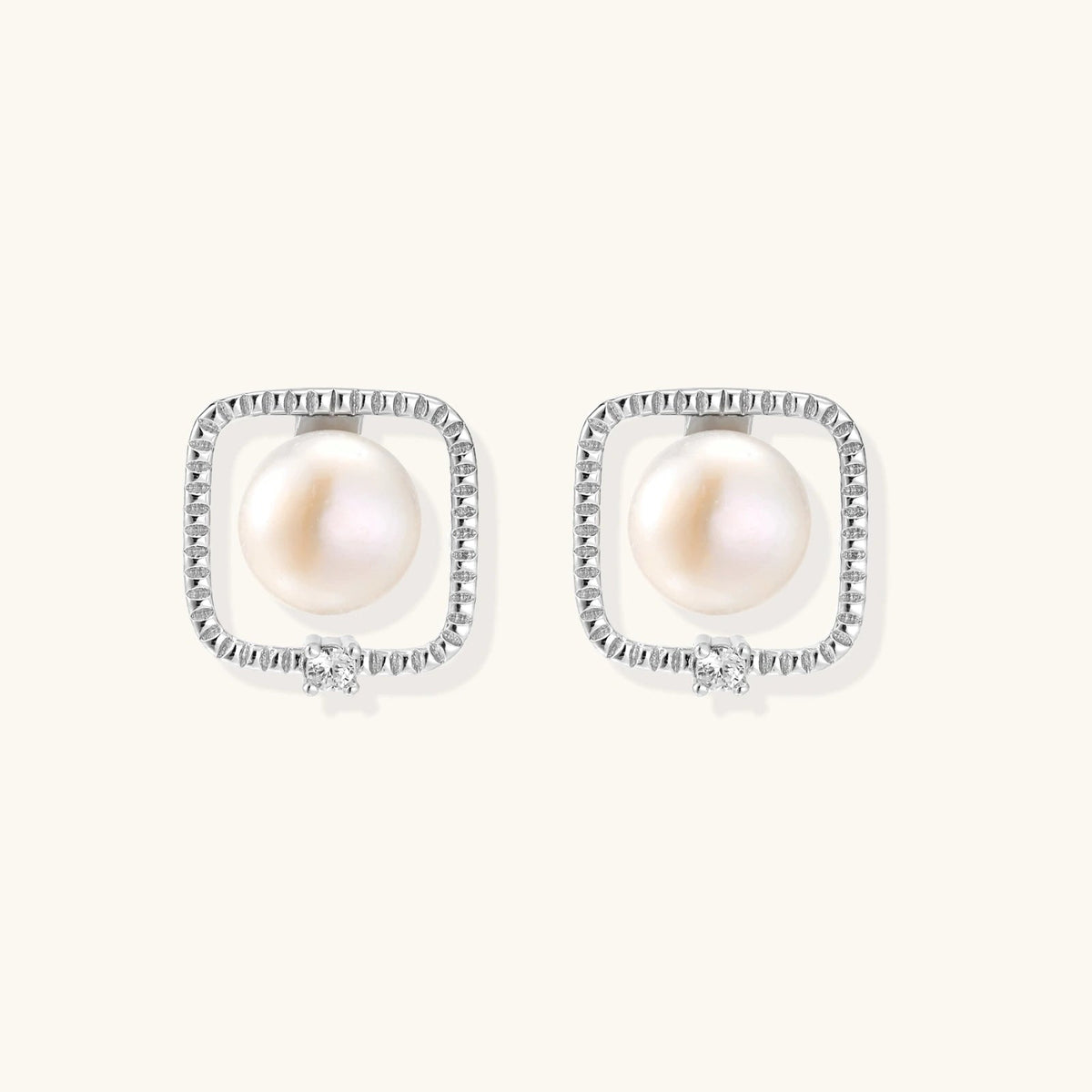Anointed Garments Pearl Halo Studs featuring round freshwater pearls in square rhodium-plated sterling silver settings.