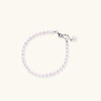 Anointed Garments Pearlescent Dreams bracelet featuring round freshwater pearls and a rhodium-plated silver pendant.