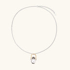 Anointed Garments Wise Penguin necklace featuring a sculptural penguin pendant holding a 9.8mm freshwater pearl.