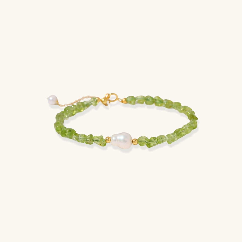 Anointed Garments Peridot Dreams bracelet featuring green peridot chips and a central freshwater pearl on silver.