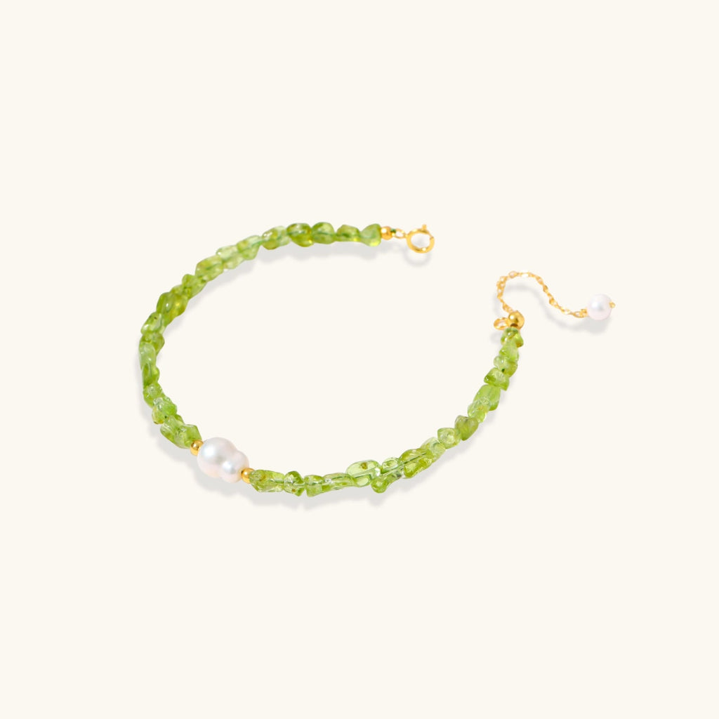 Anointed Garments Peridot Dreams bracelet featuring green peridot chip stones and a freshwater pearl on silver chain.