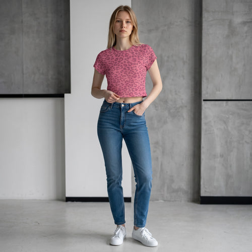 Anointed Garments pink animal print crop top with short sleeves and crew neck worn by a model with blue jeans.