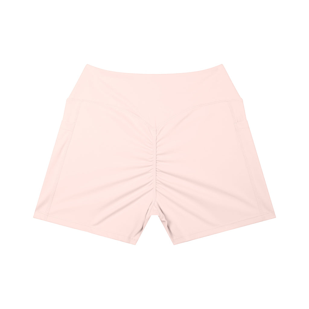 Anointed Garments light pink high-waisted athletic shorts with a ruched back and side pockets.