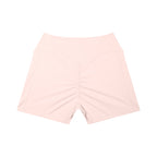 Anointed Garments light pink high-waisted athletic shorts with a ruched back and side pockets.
