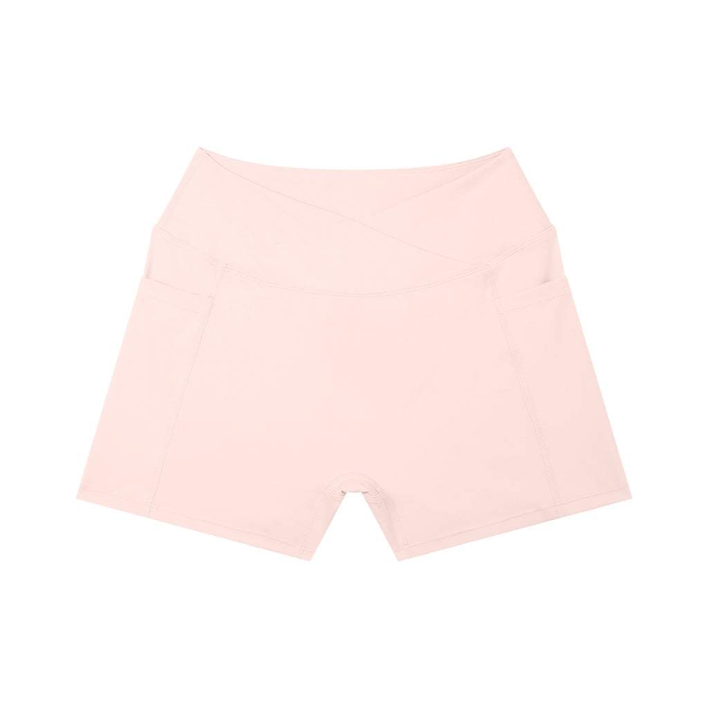 Anointed Garments light pink high-waisted yoga shorts with side pockets and a crossover waistband design.