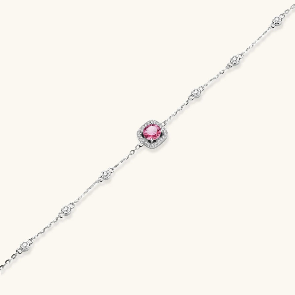 Anointed Garments Blush Dreams moissanite bracelet with a pink center stone, pavé halo, and sterling silver chain.