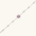 Anointed Garments Blush Dreams moissanite bracelet with a pink center stone, pavé halo, and sterling silver chain.