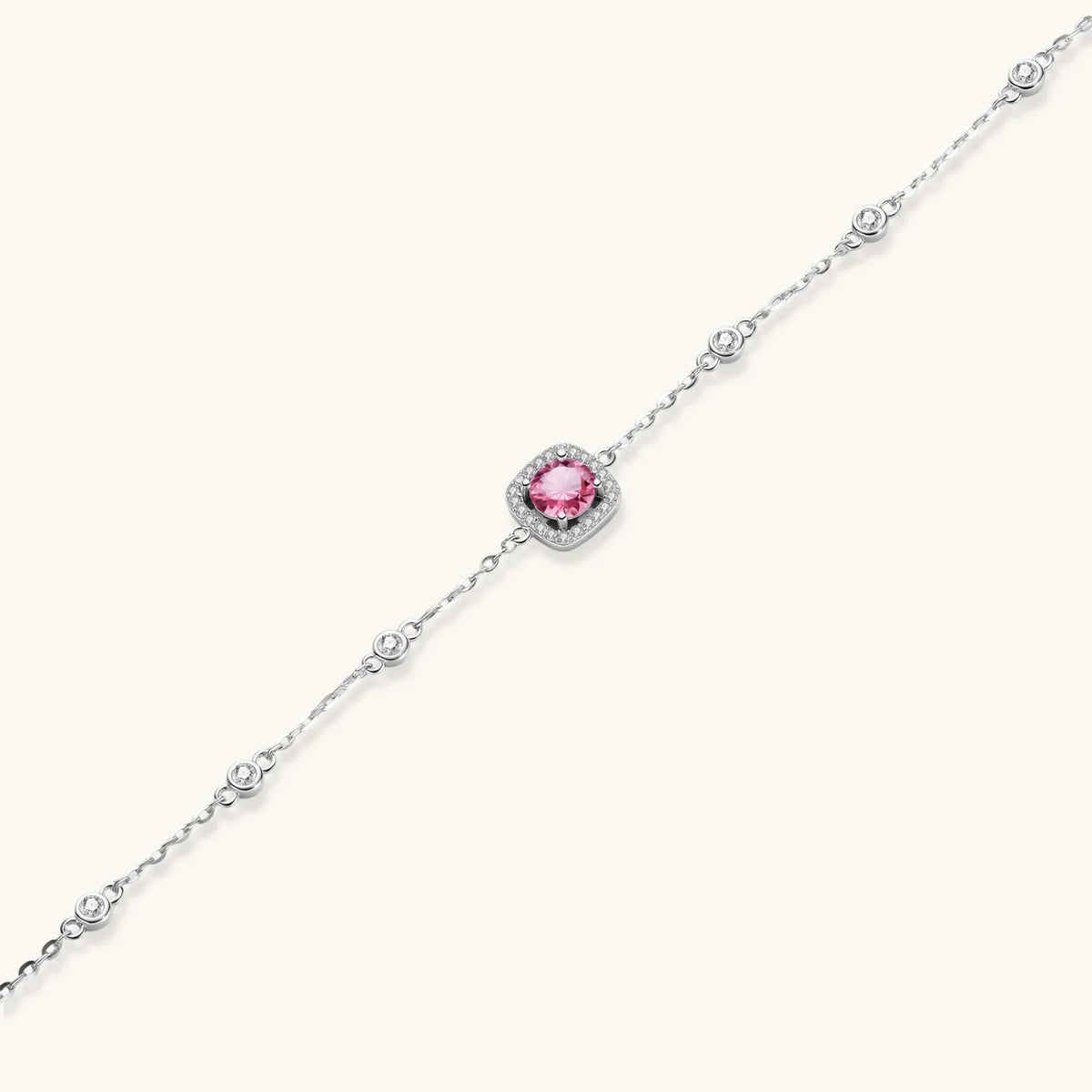 Anointed Garments Blush Dreams moissanite bracelet with a pink center stone, pavé halo, and sterling silver chain.