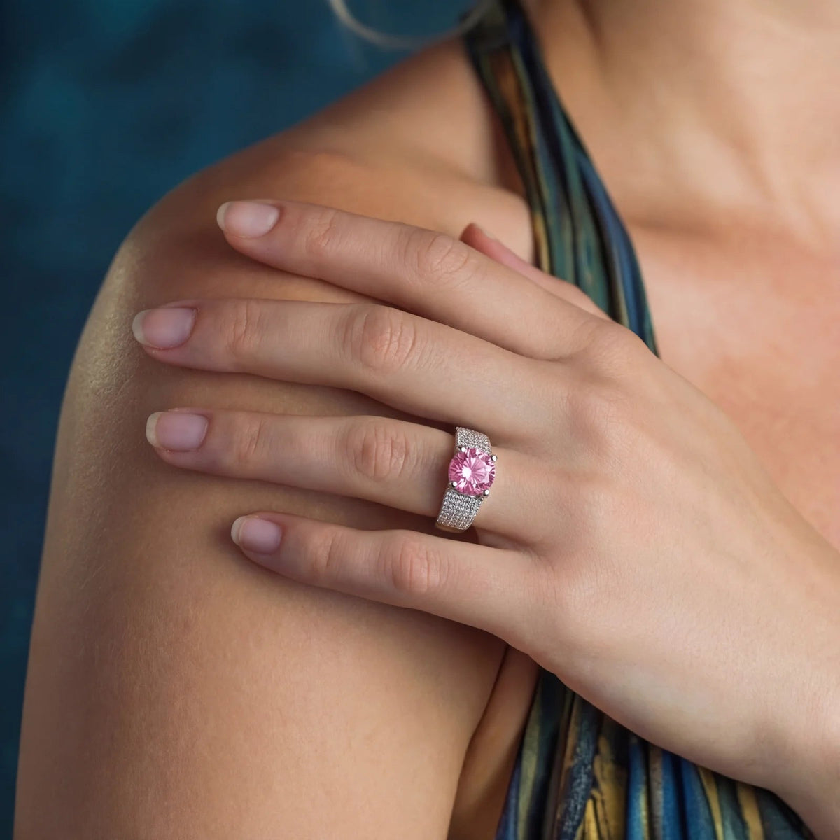 Anointed Garments adjustable ring featuring a large round pink moissanite stone set in platinum-plated 925 sterling silver