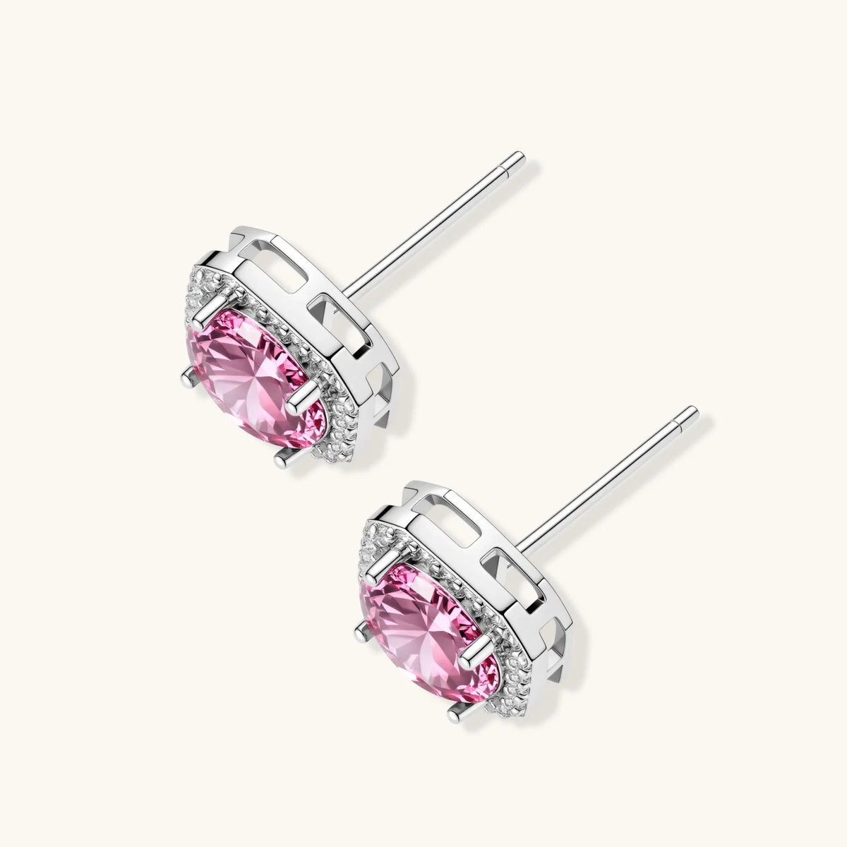 Anointed Garments blush halo moissanite stud earrings in platinum-plated 925 sterling silver with round pink stones.