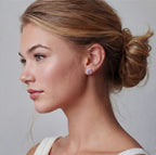 Anointed Garments Blush Halo Moissanite stud earrings featuring round pink stones in platinum-plated sterling silver.