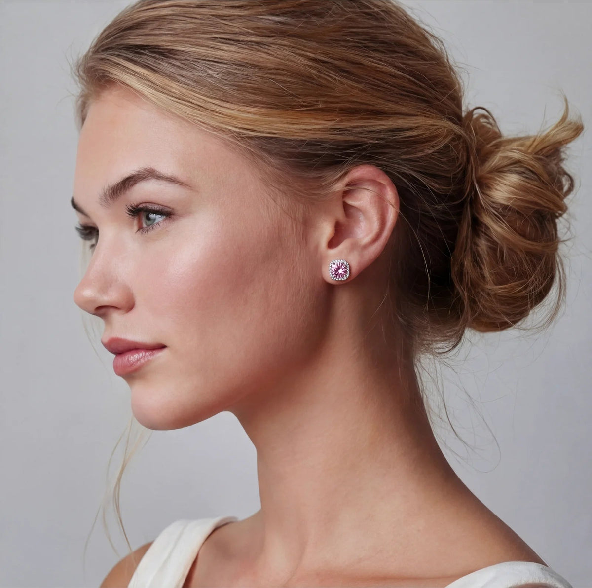 Anointed Garments Blush Halo Moissanite stud earrings featuring round pink stones in platinum-plated sterling silver.