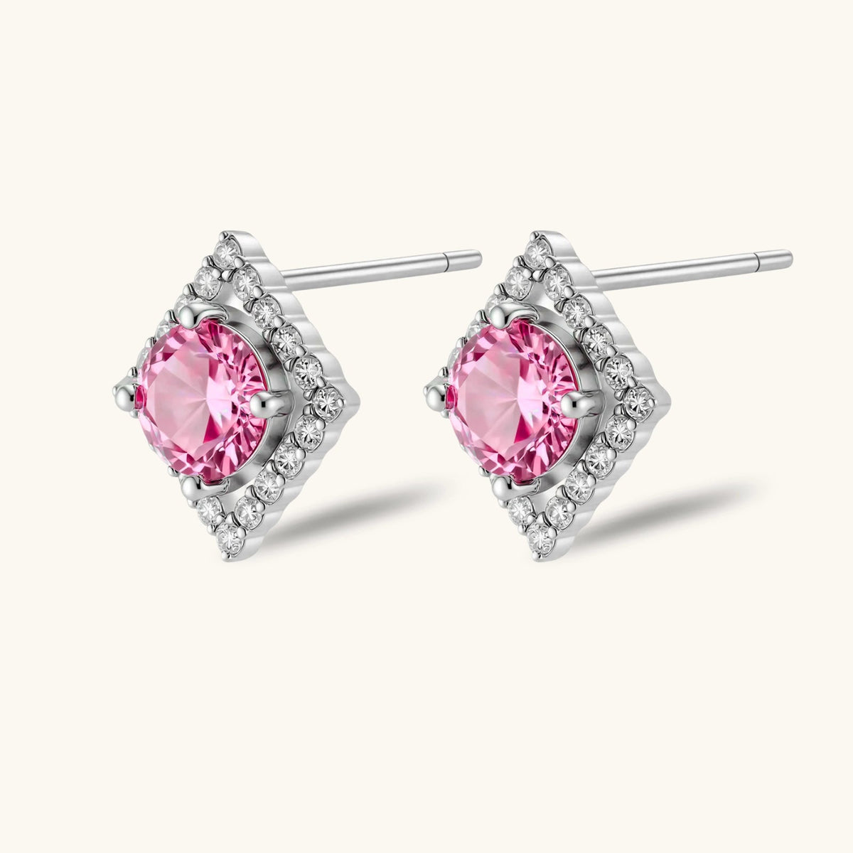 Anointed Garments pink round-cut moissanite stud earrings in platinum-plated sterling silver with geometric halo setting.