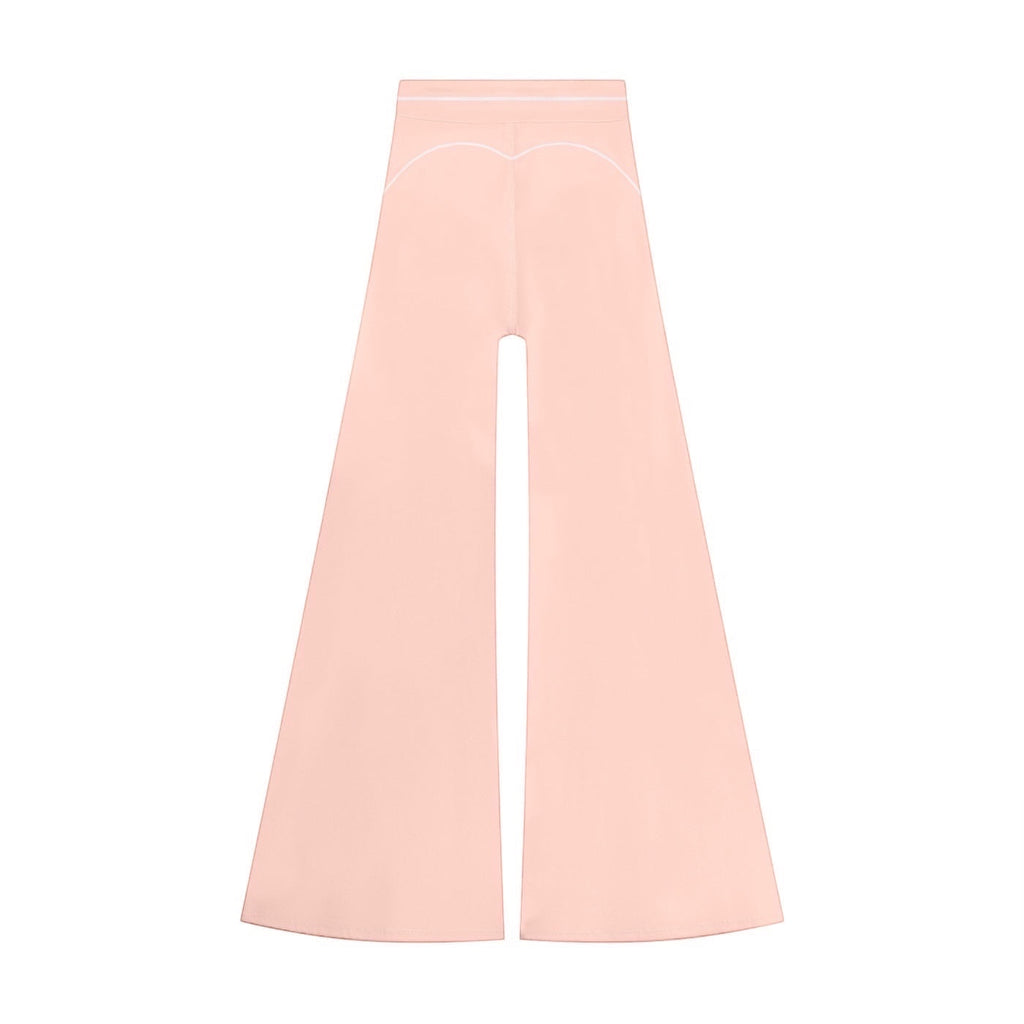 Anointed Garments high-waisted wide-leg trousers in soft pink with delicate white contrast piping detail.