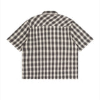 Back view of an Anointed Garments unisex short sleeve shirt in a black and white plaid pattern with a boxy fit.