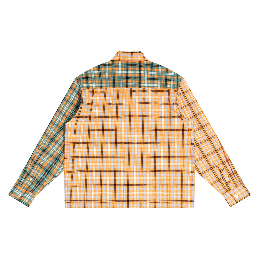 Back view of an Anointed Garments plaid button down shirt featuring a split-panel design with green and orange patterns.