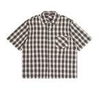Anointed Garments unisex short sleeve button-up shirt in a casual black and white plaid pattern with a chest pocket.