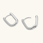 Anointed Garments platinum-plated 925 sterling silver huggie hoops with a polished finish and pavé crystal accents.