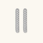 Anointed Garments platinum-plated sterling silver huggie hoops featuring a sleek, pavé-set crystal design.