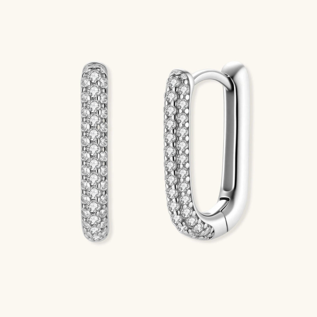Anointed Garments platinum-plated sterling silver huggie hoops with pavé-set crystals in a sleek rectangular design.