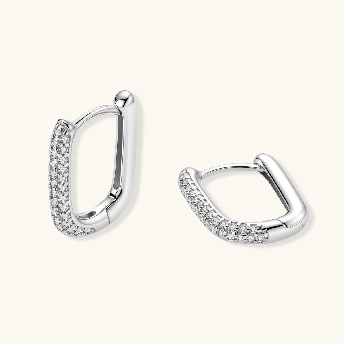 Anointed Garments platinum-plated sterling silver huggie hoops with pavé-set stones in a sleek rectangular design.