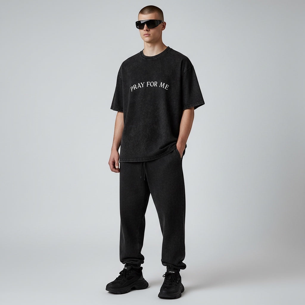 Anointed Garments Pray For Me graphic t-shirt in black mineral-wash cotton worn by a model with sunglasses