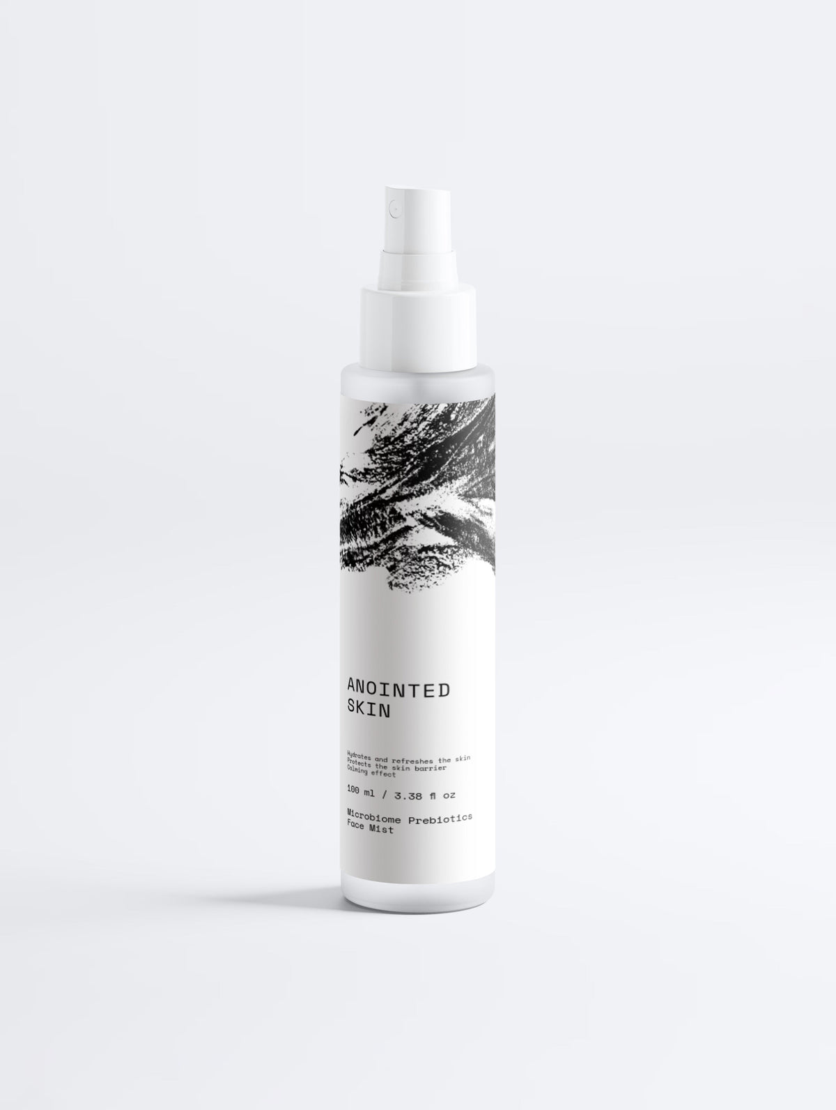 Anointed Garments Anointed Skin Prebiotic Hydrating Face Mist in a white spray bottle with black brushstroke design.