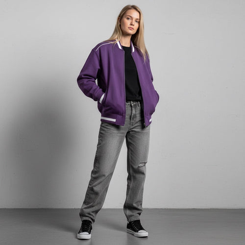Anointed Garments unisex purple bomber jacket with white trim, stand collar, and zipper, worn by a blonde model.