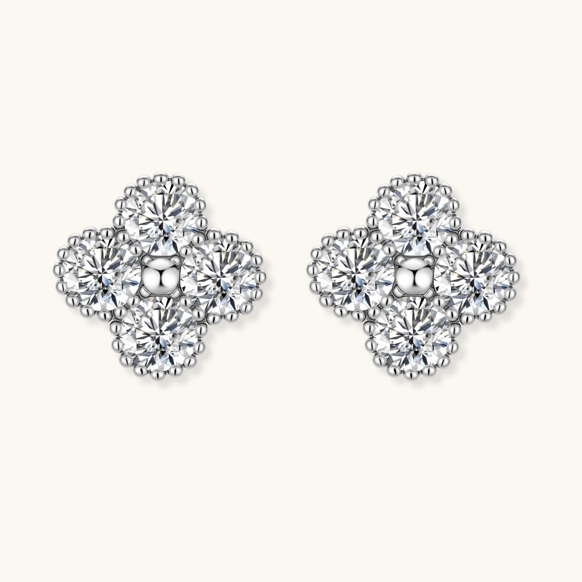 Anointed Garments quatrefoil stud earrings in platinum-plated 925 sterling silver with brilliant moissanite stones.