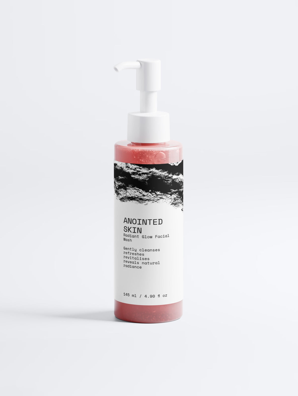 Anointed Garments Anointed Skin Radiant Glow Facial Wash in a transparent pump bottle with pink cleanser.