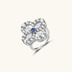 Anointed Garments adjustable ring featuring a floral design with rainbow moissanite and clear stones in platinum-plated silver