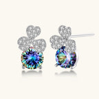 Anointed Garments rainbow moissanite stud earrings in platinum-plated 925 sterling silver with clover-shaped accents.